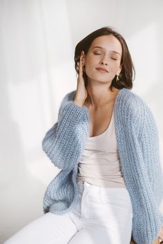 "Getting ready for the day ahead? Slip on this luxurious mohair cardigan for a cozy and comfortable fit. Delicately combining mohair, alpaca, and silk for a soft, lightweight feel, this exquisite piece offers effortless elegance no matter where you're going. With its charming style and unbeatably soft texture, you'll never want to take it off! DETAILS - Handmade. Our skillful knitters knit each garment by hand in their own homes and we are happy to provide them with the opportunity to support th How To Style Blue Cardigan, Pale Blue Cardigan Outfit, Sky Blue Cardigan Outfit, Cozy Light Blue Cardigan For Winter, Fall Light Blue Knitted Cardigan, Trendy Blue Knit Cardigan, Cozy Light Blue Winter Cardigan, Trendy Blue Soft Knit Cardigan, Sky Blue Cardigan