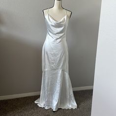 New Fully Lined White Satin Cowl Neck Maxi Dress. Slender Rolled Straps That Crisscross Atop The Backless Bodice. Sheath Silhouette That Complements The Figure As It Hugs The Hips And Gracefully Leads Into A Long Maxi Skirt With A Ruffled Hem Wedding Dress. Cowl Neck Maxi Dress, Long Maxi Skirt, Nude Dress, Maxi Gown Dress, Long Maxi Skirts, Ivory Dresses, Satin Maxi, Mermaid Gown, Maxi Dress Cotton