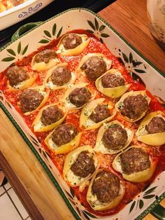 a casserole dish with meatballs and cheese on top, ready to be eaten