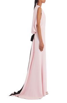 A petal pink gown presents with serene style from the front, saving the devastating drama for the elegantly opened up back, fixed with a trailing contrast bow. Jewel neck Sleeveless Open back Lined 100% silk Dry clean Made in Italy Designer Clothing Pink Wedding Dress With Back Opening, Chic Floor-length Evening Dress With Bow, Chic Bow Floor-length Evening Dress, Pink Pre-draped Floor-length Evening Dress, Pink Floor-length Dress With Tie Back, Pink Tie Back Floor-length Dress, Pink Tie-back Dress For Gala, Pink Tie Back Dress For Gala, Evening Gown With Bow, Floor-length