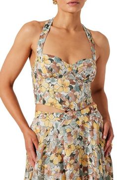 Tap into garden party style with this bustier top cut in a modern cropped silhouette. Halter neck Sleeveless 70% viscose, 30% nylon Dry clean Imported Spring Sleeveless Tube Top With Built-in Bra, Fitted Floral Print Sleeveless Crop Top, Spring Cropped Halter Top With Built-in Bra, Cropped Halter Top With Built-in Bra For Spring, Summer Sleeveless Floral Print Tube Top, Sleeveless Fitted Summer Crop Top, Summer Sleeveless Fitted Crop Top, Sleeveless Fitted Crop Top For Summer, Fitted Bandeau Halter Top For Spring