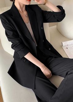 Elevate your professional wardrobe with the Monica Black Pants Suit Two-Piece Set. Crafted with a sophisticated black hue and double-breasted closure, this set exudes luxury and exclusivity. The straight-leg pants and tailored blazer provide a timeless and tasteful look for any business occasion. Blazer: Double Breasted closure Notched lapels Long sleeves Front flap pockets Pants Zip fly with button closure Side slant pockets Regular length - Polyester, spandex- Item #43197- Women's blazer & pan Black Blazer Suit For Women, Tailored Suits Women, How To Style Black Blazer, Tailored Suit Women, Black Blazer Women, Black Double Breasted Blazer, Mafia Wives, Styles Clothes, Black Pant Suit