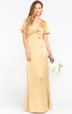 The Rome Twist Gown is an empire waist with a twist! She has a flutter sleeve, a dramatic v-neck line met with a modern twist on the bust. From this empire fixed waist, her skirt falls straight down for a stunningly statuesque silhouette. Mustard Bridesmaid Dresses, Metallic Bridesmaid Dresses, How Many Bridesmaids, Neutral Bridesmaid Dresses, Dress Satin Bridesmaid, Goddess Gown, Maternity Bridesmaid Dresses, Gold Bridesmaid Dresses, Yellow Bridesmaid Dresses