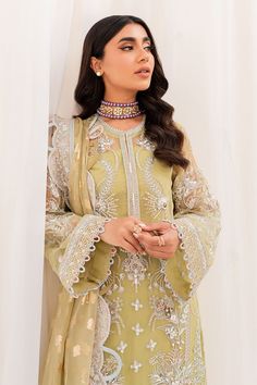 Pakistani Embroidered Kameez Crushed Sharara Yellow Wedding Dress has the perfect balance of style and grace. This masterpiece comes in premium quality fabric and is adorned with threads, mirror details, and cutwork, making it an epitome of beauty and elegance. Embroidered Kameez: The wedding dress kameez has a beautiful yellow color. Hand-crafted details of dabka, motifs, and pearls give a glamorous look to this yellow kameez. Mirror details, threads, and cutwork give a perfect finish to the ka Bollywood Style Embroidered Dress In Georgette, Elegant Embroidered Dress With Mirror Work, Bollywood Style Embroidered Georgette Dress, Anarkali Embroidered Dress With Intricate Details For Eid, Anarkali Embroidered Dress With Intricate Embroidery For Eid, Elegant Embroidered Dress With Mirror Work For Eid, Designer Embroidered Dress For Eid, Reception Churidar With Intricate Embroidery In Georgette, Reception Georgette Lawn Suit With Mirror Work