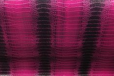 an image of pink and black alligator skin