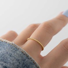 Dainty beaded ring that is perfect for stacking or wearing alone for a minimalist look! - - - D E T A I L S - - - * Made of 925 Sterling Silver * We use a THICK, DURABLE 14k Gold or Rhodium plating - for a piece that will last you years to come! * Nickel-free & Hypoallergenic * Available in Sizes 4, 5, 6, 7, 8, 9, or 10 * Ring width: 1.3mm Ring Sizer- https://www.etsy.com/listing/1240904225/ring-sizer-reusable-ring-sizer-plastic?click_key=b5e074cfb419bcfddc2d9f2ce4b2f5376e4b8de0%3A1240904225&cli Chunky Earrings, Friendship Rings, Braided Ring, Bridesmaid Gifts Jewelry, Zierlicher Ring, Twist Ring, Gold Ring Stack, Rings Simple, Minimalist Rings