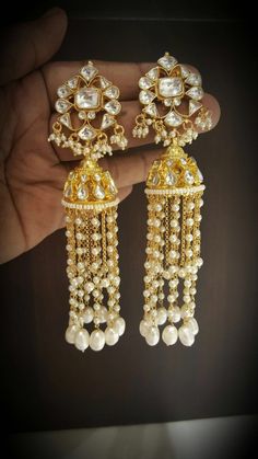 *It's Handmade Indian Ethnic Kundan Earrings. *It's made from Silver n Copper with White Kundan Stones Settings and Pearl Drops with 22k gold Plating as shown in picture. *It it Pure Ethnic Look with Ethnic Touch and 3.5 inches Long. *Our all jewelry is made from semiprecious stones and beads. *WARRANTY: ITS GENUINE HANDMADE JEWELRY AND WE ARE GIVING LONG LIFE WARRANTY FOR OUR ALL ITEMS. All of our Kundan Jewelry is 100% handmade with ancient Kundan stone setting method using silver foils. It is Luxury Kundan Dangle Danglers, White Tilla Bridal Earrings For Eid, White Bridal Earrings With Tilla For Eid, White Bridal Earrings For Eid Celebration, Festive White Cutdana Bridal Earrings, Temple Style Pearl Earrings With Latkans For Festivals, Temple Jewelry Pearl Earrings With Latkans For Festivals, Festive Pearl Earrings With Stone Work For Diwali, Traditional Pearl Earrings With Stone Work For Festive Season