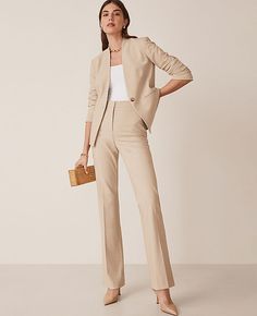 Elevate your wardrobe with the Ann Taylor Petite High Rise Skinny Trouser Pant in Bi-Stretch, a perfect blend of style and comfort. These trousers are designed to flatter and maintain their shape, ensuring you look polished from morning to evening.

- **Size:** Petite 14
- **Color:** Toasted Oat
- **Material:** 66% Polyester, 28% Rayon, 6% Spandex
- **Gender:** Female
- **Fit:** Tailored and fitted
- **Rise:** High rise, sits 1/2" to 1" below natural waist
- **Leg Shape:** Trouser with a slight Womens Tan Suit Work Outfits, Women’s Work Attire, Ann Taylor Work Outfits, Women’s Trousers, Women’s Work Wear, Khaki Suit Women, Flare Dress Pants Outfit, Beige Suits Women, Women’s Suits