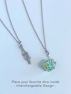 two necklaces with the words, place your favorite piece inside interchangeable design