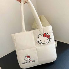 Kawaii Sanrio My Melody Kuromi Cinnamoroll Hello Kitty Puffer Bag – The Kawaii Factory White Cartoon Travel Bags, White Cartoon Style Travel Bags, White Cartoon Bags For Daily Use, Cartoon Style White Bag For Daily Use, White Cartoon Bag With Cute Design, White Cartoon Style Bag With Cute Design, Kawaii Hello Kitty Print School Shoulder Bag, Cute Hello Kitty Rectangular Shoulder Bag, Kawaii Hello Kitty Print Travel Bag