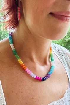 Wear the rainbow with this joyful and colorful gradient gemstone necklace. Faceted rondelle beads gives this necklace just the right amount of sparkle. Wear this as a statement necklace or stack it in a neckmess with your other favorites. ✨The Magic is in the Details✨ Necklace Lenth: 19"-21" (adjustable)Clasp: Lobster clasp and chainApprox. Bead Size: 8x5mmMaterial: Dyed Jade* Jade is sensitive to sunlight and water. Prolonged exposure to either one will cause these beads to fade over time. ✌🏼? Multicolor Single Strand Rondelle Beaded Necklaces, Multicolor Rondelle Beaded Necklaces Single Strand, Rainbow Rondelle Beaded Jewelry, Multicolor Rondelle Beaded Necklace Single Strand, Rainbow Rondelle Gemstone Bead Necklaces, Rainbow Rondelle Gemstone Beaded Necklace, Rainbow Rondelle Gemstone Beads Necklace, Rainbow Single Strand Beaded Necklaces With Round Beads, Rainbow Gemstone Beaded Necklace With Round Beads