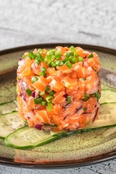 a plate topped with cucumber and smoked salmon