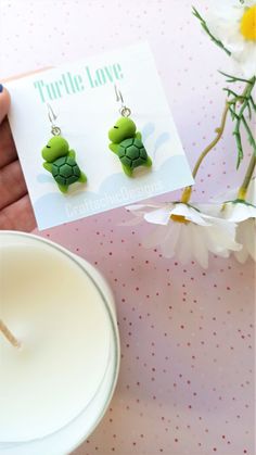 Super cute Turtle earrings, made from resin, in green colors. The closure is leverback, which is very comfortable and easy to wear, just click the back up and you're ready to show them off. The leverback makes sure the earrings will not fall out of your ear and it doesn't require additional pieces to make them secure. Packaging Materials: cardstock backing, holographic ziplock Size: 4 cm (total lenght) 1.5 cm (width) Find Me Here: Facebook: https://www.facebook.com/craftachicdesigns Instagram: h Earrings Kawaii, Cute Turtle, Cute Turtles, Turtle Earrings, Earrings Cute, Packaging Material, Silver Hoops, Handmade Earrings, Romania