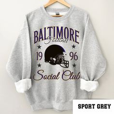 Perfect sweatshirt for Baltimore football fans this season! Ideal for any situation, a unisex heavy blend crewneck sweatshirt is pure comfort. These garments are made from polyester and cotton. This combination helps designs come out looking fresh and beautiful. The collar is ribbed knit, so it retains its shape even after washing. There are no itchy side seams on these sweaters.  .: 50% cotton, 50% polyester .: Medium-heavy fabric (8.0 oz/yd² (271.25 g/m .: Loose fit .: Sewn-in label .: Runs tr Collegiate Crew Neck Sublimation Design For Football Season, Sublimation Crew Neck T-shirt With Letter Print For Fans, Crew Neck Sublimation T-shirt With Letter Print For Fans, Athletic Heather Crew Neck Sweatshirt For Fan Gear, Sublimation Letter Print Crew Neck For Fan Gear, Athletic Heather Sweatshirt For Sports Fan Gear, Football Fan Apparel Sweatshirt, Pre-shrunk, Athletic Heather Fan Apparel Sweatshirt For Sports Season, Sports Fan Sweatshirt With Letter Print For Streetwear