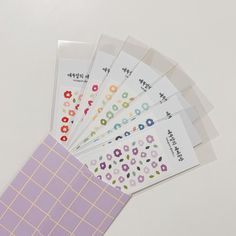 six sheets of stickers with flowers on them sitting next to each other in front of a white background