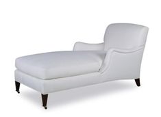 a white chaise lounge chair with black legs