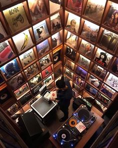 an overhead view of a dj's room with record players and records on the walls