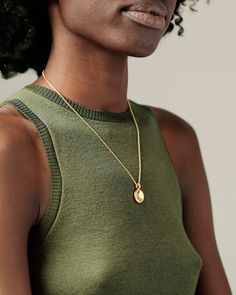 Description A gorgeous big sibling to our beloved Button Pendant, the Button Grand Pendant offers the same delight of pressing that soft center of buttery gold, but on a larger scale. Perfect to layer with different chain lengths and pendants. The finely crafted bail can accommodate our chains without the need of a jump ring, offering a more streamlined and solid feel. Solid gold to the core; never hollow. Its heft will thrill you. Explore the Button Collection. Details Solid 18k yellow gold (no Elegant Pendant Locket Necklace For Everyday, Elegant Yellow Gold Medallion Necklace With Large Pendant, Elegant Everyday Pendant Locket Necklace, Elegant Polished Coin Pendant Necklace, Elegant Round Coin Necklace With Locket, Elegant Large Oval Medallion Necklace, Elegant Oval Medallion Necklace With Large Pendant, Elegant Everyday Medallion Necklace, Elegant Medallion Locket Coin Necklace