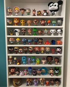 a book shelf filled with lots of toy figurines