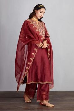 Garnet red long kurta with placement aari worked motifs and side slits. Comes with sheer panelled pants and silk organza dupatta.
Component: 3
Embroidered
Neckline: Round
Sleeve Length: Long
Fabric: Kurta and Pant: Handwoven Chanderi; Dupatta and Pant: Silk Organza; Kurta: Cotton Voile
Color: Red
Side slits
Scallop cutwork
Split neck
Sheer panel - Aza Fashions Gharara Designs, Chanderi Dupatta, Shadi Dresses, Red Kurta, Fancy Suit, Kurta Set For Women, Indian Designer Suits, Salwar Designs, Indian Dresses Traditional