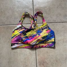 Multicolored Sports Bra. Nwots Never Worn And In Perfect Condition Multicolor Racerback Activewear For Sports, Multicolor Casual Activewear For Running, Casual Multicolor Activewear For Running, Multicolor Racerback Athleisure Activewear, Multicolor Racerback Activewear Athleisure, Sporty Multicolor Racerback Activewear, Multicolor Moisture-wicking Racerback Activewear, Multicolor Sports Bra For Training, Sporty Multicolor Sports Bra For Gym