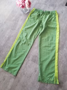 Vintage Nike Track Pants Green Lime Polyester Sweatpants Black Ankle Swoosh Y2K Skate / Streetwear Great Condition: 9/10 Youth Size: Large My Hands in Pockets = It has Pockets No Hands in Pockets = Does Not Have Pockets Drawstring Will be Visible in Forward Pic, if not Visible it Does Not Have a Drawstring About me: I am 5' 3" for reference I generally wear a Small I Model XS to 2XL sweatpants, I find that you can often size up or down with 95% of sweatpants and they fit the same Sporty Green Gym Bottoms, Casual Green Sweatpants With Elastic Side Panels, Casual Green Pants With Elastic Side Panels, Sporty Stretch Green Pants, Green Stretch Sporty Pants, Sporty Green Pants With Elastic Side Panels, Green Full-length Gym Pants, Green Full Length Sportswear Bottoms, Green Sportswear Pants For Workout