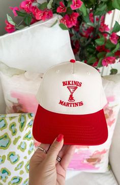 Whether you're sipping martinis under the palm trees or lounging by the pool, let this hat be your go-to accessory for the best summer vibes, one bikini and martini at a time! Twill cap Made in USA Embroidery at front and side panel Adjustable back strap Brim measures approx 3" in lengthOS measures approx 23.55" in circumference White Curved Brim Hat For Pool, Retro Baseball Cap For Vacation, White Vacation Hat For Pool, White Vacation Hats For Pool, White Beach Season Hat For Pool, White Vacation Snapback Hat, White Beach Season Hat, White Hat For Poolside Vacation, Adjustable White Hats For Pool