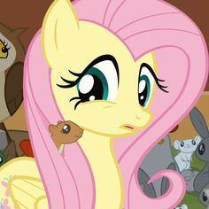 the pinkie pony is surrounded by other ponies