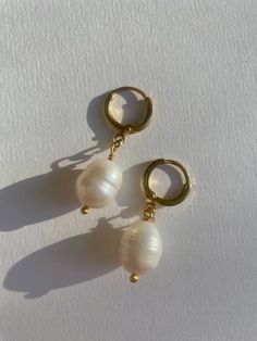 Freshwater pearl earrings, 10mm genuine high lustre pearls, on a delicate gold plated huggie hoop earring. Sold in pairs Also available in a 925 sterling silver hoop, available on request Pearl Charm Huggie Earrings, White Huggie Pearl Earrings With Ear Wire, White Pearl Huggie Earrings, White Pearl Huggie Earrings With Ear Wire, Classic Huggie Earrings With Pearl Charm As Gift, Gift Pearl Drop Huggie Hoop Earrings, Gift Huggie Hoop Earrings With Pearl Drop, Pearl Drop Huggie Earrings As Gift, Pearl Drop Huggie Hoop Earrings