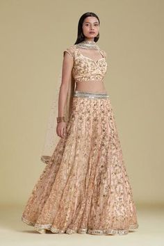 Peach lehenga with pearl, sequin, cutdana and bead embroidered floral motifs. Comes with blouse and sheer dupatta.
Components: 3
Fabric: Tulle, Silk
Neckline: Leaf
Sleeve Length: Cap
Color: Peach
Embroidery
Hand embroidery
Side tassel tie-up detail on lehenga
Pearl, sequin, bead and cutdana embroidered floral motifs on blouse
Deep back with tassel tie-up detail on blouse
Sequin motifs on dupatta
Closure: Concealed back hook placket on blouse - Aza Fashions Threadwork Embroidery, Embroidered Bridal Lehenga, Peach Lehenga, Gold Lehenga, Embroidered Lehenga, Silk Tulle, Designer Gowns, Bridal Lehenga, Embroidered Silk