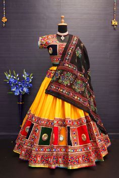 This Lehenga Choli is Ready to Wear This Navratri (Garba) Wear Yellow Color Mirror Work Rayon Cotton Lehenga Choli is accenting the charming feeling. The mirror work work appears to be chic and fantastic for any function. Lehenga: Pure Heavy Rayon Cotton with Heavy work Border and Handmade Bangadi with Paper Mirror Work and Embroidery Patches. CHOLI: Cotton full embroidery and with handmade bangadi work full Stitched Dupatta Fabric - Cotton Dupatta Color - Yellow & Multi Color Style -Navratri En Gujarati Traditional Dress, Semi-stitched Yellow Lehenga With Motifs, Yellow Semi-stitched Lehenga With Motifs, Embroidered Lehenga For Traditional Ceremonies And Navratri, Bollywood Style Lehenga With Motifs For Navratri, Yellow Festive Sets With Motifs, Festive Yellow Sets With Motifs, Festive Yellow Lehenga With Motifs, Semi-stitched Motifs Choli For Festival