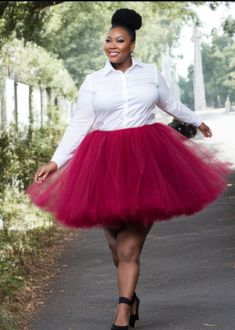 Experience the joy of twirling and feeling absolutely beautiful with our made-to-order Plus Size Mid Length Tutu. This enchanting skirt is lovingly crafted by tying strips of premium tulle to a comfortable elastic waistband, ensuring a perfect fit that accentuates your natural curves. Measuring 20 inches long, this tutu strikes the ideal balance between elegance and playfulness, allowing you to radiate confidence and grace with every step. Its versatile length ensures that it flatters a variety of body types and can be effortlessly styled for various occasions. With over 30 different color options to choose from, you have the freedom to express your unique style and personality. Whether you prefer soft pastels, vibrant jewel tones, or classic neutrals, our wide selection guarantees a hue t Plus Size Tutu, Adult Tulle Skirt, Radiate Confidence, Natural Curves, Beautiful Skirts, Jewel Tones, You Choose, Body Types, Mid Length