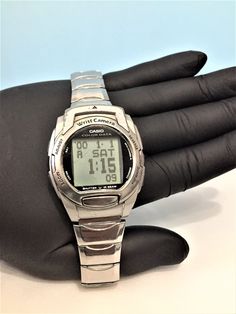 Title; Rare Casio WQV-3 Wrist Camera Watch Module 2411/ Orginal Stell Cord/ Original casio / Great collectible watch/ Silver  Color case Rare model ✔️ ✈🎁 Fast shipping UPS Express (Europe 2-3 days) (America 3-5 days) (Australia 5-8 days) (Canada-4-8 day ⏰ ✔️The Casio WQV-3 Wrist Camera Watch is a vintage digital wristwatch produced by Casio. It was released in the late 1990s and was one of the first wristwatches to feature a built-in digital camera. The watch had a monochrome camera with a resolution of 120 x 120 pixels, which allowed users to capture low-resolution images. ✔️The WQV-3 watch featured a small LCD display that could show the time, date, and images taken with the camera. It had limited storage capacity, allowing users to store only a few images at a time. The watch also had Cheap Retro Analog Watches, Casio Camera, Collectible Watch, Camera Watch, Unique Gadgets, Wristwatch Men, Watch Collection, 8 Days, Casio Watch