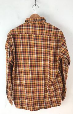 "-Description- >men orange, yellow, green, red plaid shirt >button front >collared >open pocket on the front >size medium >perfect plaid for the fall/autumn! >condition: great >color(s): orange, yellow, green, red, white >fabric(s): cotton >brand: john ashford >care: machine wash -Measurements- >size: medium ✩ all measurements are taken with the item laying flat & some sizes are estimates so please check measurements ✩ chest:44\" / 112cm length: 30\" / 76c Plaid Collared Shirt With Placket, Collared Plaid Shirt With Placket, Fall Orange Shirt With Button Closure, Orange Fall Shirt With Button Closure, Plaid Collared Shirt, Fall Multicolor Collared Shirt, Multicolor Button-up Flannel Shirt For Fall, Classic Multicolor Shirt For Fall, Yellow Shirt With Button Closure For Fall