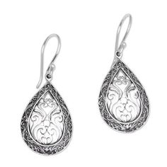 Dewa Arimbawa handcrafts these teardrop sterling silver dangle earrings. Scrolling motifs abound in this elegant design with a border of Balinese tendrils and scrolled openwork in the center. Traditional Sterling Silver Teardrop Earrings As Gift, Ornate Sterling Silver Teardrop Earrings For Gift, Ornate Sterling Silver Teardrop Earrings As Gift, Traditional Nickel-free Sterling Silver Teardrop Earrings, Sterling Silver Teardrop Crown Earrings For Gift, Traditional Handmade Sterling Silver Teardrop Earrings, Traditional Silver Teardrop Pierced Earrings, Handmade Ornate Teardrop Earrings, Traditional Silver Drop Earrings