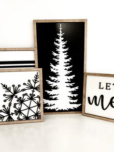 three cards with black and white designs on them, one has a snowflake