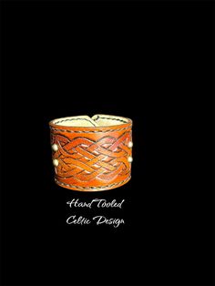 Custom, unique, hand made leather cuff. High quality construction and artistic Celtic design. Made with the best quality products and personal care. This cuff should give you years of enjoyment. Brown Hand Wrapped Cuff Bracelet For Gift, Unique Handmade Leather Cuff Bracelet, Hand-tooled Cuff Bracelets As Gift, Hand Tooled Cuff Bracelets As A Gift, Hand Tooled Cuff Bracelet For Gift, Handmade Artisan Brown Cuff Bracelet, Unique Leather Bangle Bracelet For Gifts, Vintage Leather Strap Cuff Bracelet Gift, Leather Strap Cuff Bracelet Gift