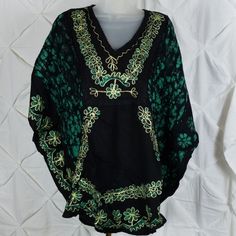 Very Stylish Embroidered Caftan. Lightweight And Comfortable. Wear As An Everyday Shirt Or A Swimsuit Cover-Up. Many Color Choices Available In Separate Listings. This One Is A Green/ Blue. Traditional Black Kaftan For Vacation, Black Embroidered Kaftan For Vacation, Summer Black Kaftan With Floral Embroidery, Beach Green Kaftan With Floral Embroidery, Casual Black Kaftan For Festival, Black Floral Embroidered Kaftan For Festivals, Traditional Black Tops For Vacation, Traditional Black Free Size Kaftan, Black Free Size Casual Kaftan