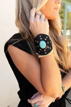 A gorgeous leather cuff speaks to your boho spirit and this wide statement - band comes in an array of stones like the colors of the Aegean Sea. Brassy rivets accent circles of tooled leather that are tanned to flatter each stone. The snap is inscribed with the Three Bird Nest logo and a double closure lets you choose the fit you like for this timeless piece. Will fit most wrists sized up to 7.75" | Due to the nature of the cuffs variations in the exact leather finish will happen but are minimal Black Bohemian Leather Bracelet, Black Hand-tooled Bohemian Jewelry, Black Hand Tooled Bohemian Jewelry, Bohemian Leather Cuff Bracelet For Festival, Black Bohemian Hand-tooled Jewelry, Adjustable Bohemian Leather Cuff Bracelet, Bohemian Leather Bracelet With Beads, Black Beaded Bohemian Leather Bracelet, Bohemian Leather Cuff Bracelet