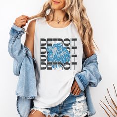 This Detroit Football shirt has a retro vibe with a fun Lions Football inspired graphic. Celebrate Football Season with game day shirt that you will want to wear on repeat. Comfort Colors are the most popular and trending shirts right now. This shirt will soon be your favorite with fabric created to be softer and feel broken in. The elevated dyeing process reduces shrinking up to 99% and the shirt is made from 100% ring spun cotton. - M A T E R I A L S - 100% Ringspun US cotton Medium fabric (6. Slogan Sleeveless Top For Streetwear, Retro Sleeveless Tank Top With Letter Print, Sleeveless Slogan Tops For Streetwear, Retro Sleeveless Letter Print Tank Top, Sleeveless Cotton Slogan Top, Sleeveless Cotton Top With Slogan, Slogan Tank Top For Streetwear, Slogan Sleeveless Tank Top For Streetwear, Casual Sleeveless Muscle Tee With Screen Print