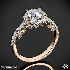 an engagement ring with two rows of diamonds on the band and a center stone in the middle