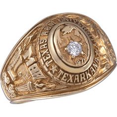 a gold ring with a diamond in the center and an inscription on it that says texas rangers