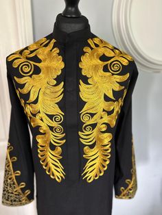 Handmade African Traditional Men's Embroidery Bishop/Rev-Neck Collar Tunic Top in Long Sleeve. * 𝐋𝐈𝐆𝐇𝐓𝐖𝐄𝐈𝐆𝐇𝐓 𝐅𝐀𝐁𝐑𝐈𝐂: Our men's occasional traditional tunic tops  are crafted with premium cotton that makes you soft feel and comfortable * 𝐏𝐄𝐑𝐅𝐄𝐂𝐓 𝐅𝐈𝐓𝐈𝐍𝐆𝐒: This men's summer and fall tunic top is perfectly tailored for a great fit, which is breathable and ensures you relax all day long * 𝐋𝐎𝐍𝐆 𝐒𝐋𝐄𝐄𝐕𝐄: Enjoy the ultimate comfort during summer and fall outdoor a Fitted Long Sleeve Kaftan For Ceremonial Occasions, Ceremonial Embroidered Sets With Stand Collar, Traditional Long Sleeve Set With Gold Embroidery, Black Long Sleeve Sets With Gold Embroidery, Gold Long Sleeve Bandhgala For Traditional Ceremonies, Long Sleeve Kurta With Gold Embroidery For Traditional Ceremonies, Fitted Long Sleeve Embroidered Kaftan, Fitted Long Sleeve Kaftan With Gold Embroidery, Embroidered Sets With Stand Collar For Festivals