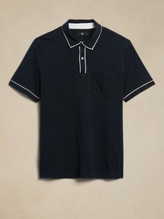 Our designers added small, contrast color accents at the collar and cuffs of this polo shirt.  Here, our best-selling Luxury-Touch cotton jersey delivers its signature softness and a smooth finish that leans more dressed-up in appearance.  Polo collar with button placket.  Front pocket.  Straight hem with vented sides.  Standard fit.  Short sleeves.  Hip length.  Body length (size M): Regular 28", Tall 29. 5" Sleeve length from center back: Regular 18", Tall 19" Model: Size M, 6'2" (188cm). Color Accents, Camisa Polo, Polo Collar, Collar And Cuff, Curator Style, Hip Length, Button Placket, Accent Colors, Charcoal Grey