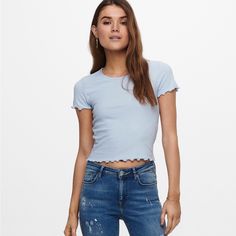 Elodie Pointelle Knit Lettuce Trim Cap Sleeve Tee In Blue, Size M, Nwt *1st Pic Shows A Similar Style Of Wear. *Bundle & Save! Thank You So Much For Checking Out My Closet! I Love To Offer Great Deals And Will Always Take Offers Or Counter My Very Lowest Due To Pm Fees! I Ship Quick And Strive To Make Your Process Seamless! Please Note I Do Not Offer Measurements On Items And Those Questions Will Be Respectfully Left Unanswered. Have A Wonderful Day! Bnaa4 3-165 Trendy Light Blue Knit Tops, Light Blue Ribbed Knit Top, White Sheer Top, Cutout Crop Top, Maroon Blouse, Cap Sleeve Tee, Light Blue Shorts, Pointelle Knit, Floral Print Shirt