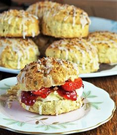 scones filled with strawberries and cream on a plate