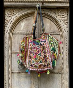 About bag  Indo-gypsy fusion, everyday use hand bag made from Banjara fabrics sourced from Vintage tribal costumes of regions of Rajastan and Gujarat. These are embellished with light catching coins, and intricate bead work tassels. Size - length 15 inches/ width 21 inches Company details:  Company name: Houseoftextile  Contact number: +919784447473  Email id: houseoftextile77@gmail.com  Shipping & custom : Delivery through one of the finest service providers : Skyway, Fedex, UPS  And DHL. Any l Email Id, Messenger Bags, Gmail Com, Bag Making, Bead Work, Ups, Tote Bag, Embroidery, Beads