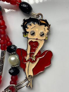 Vintage Betty Boop necklace , red and black beads Party Red Beaded Necklaces With Black Beads, Red Necklace With Black Beads For Party, Retro Red Necklace For Party, Gift Red And Black Beaded Necklaces, Red And Black Beaded Necklaces For Gifts, Red And Black Beaded Necklace For Gift, Gift Red Beaded Necklaces With Black Beads, Red Beaded Necklaces With Black Beads For Gifts, Retro Red Beaded Necklace