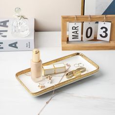 a tray that has some items on it and is sitting next to a calendar with the number ten