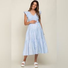 A Solid Hue Maternity Midi Dress. Features A V-Neck, Smocked Bodice, Flutter Cap Sleeves, A Ruffle Waist Accent, Side Pockets, And A Tiered Skirt. Skirt Is Partially Lined. 100% Cotton &Merci By Pinkblush New Without Tags Small Inventory #P5162 Large Inventory #P6226 Spring V-neck Smocked Dress For Daywear, Summer Maternity Midi Dress With Smocked Back, Cotton Ruched V-neck Midi Dress, Cotton V-neck Ruched Midi Dress, Maternity V-neck Ruched Dress, Maternity Dresses With Smocked Back And Short Sleeves, Maternity Short Sleeve Dresses With Smocked Back, Blue V-neck Maxi Dress With Smocked Back, Maternity Midi Dress With Smocked Bodice